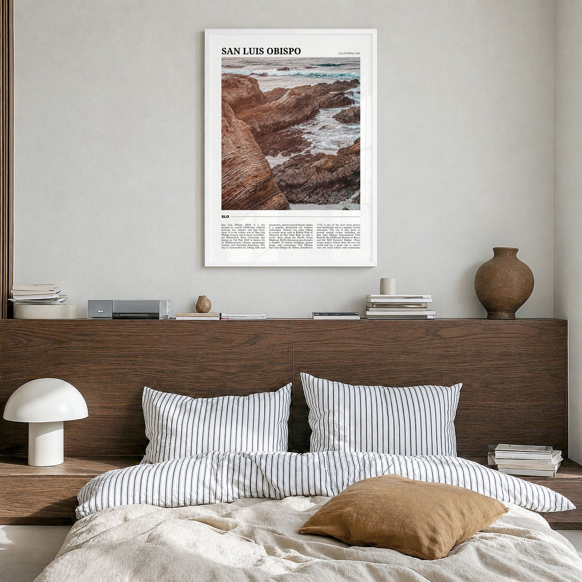 San Luis Obispo Travel No 1 Poster in a white wood frame, hanging in a bedroom