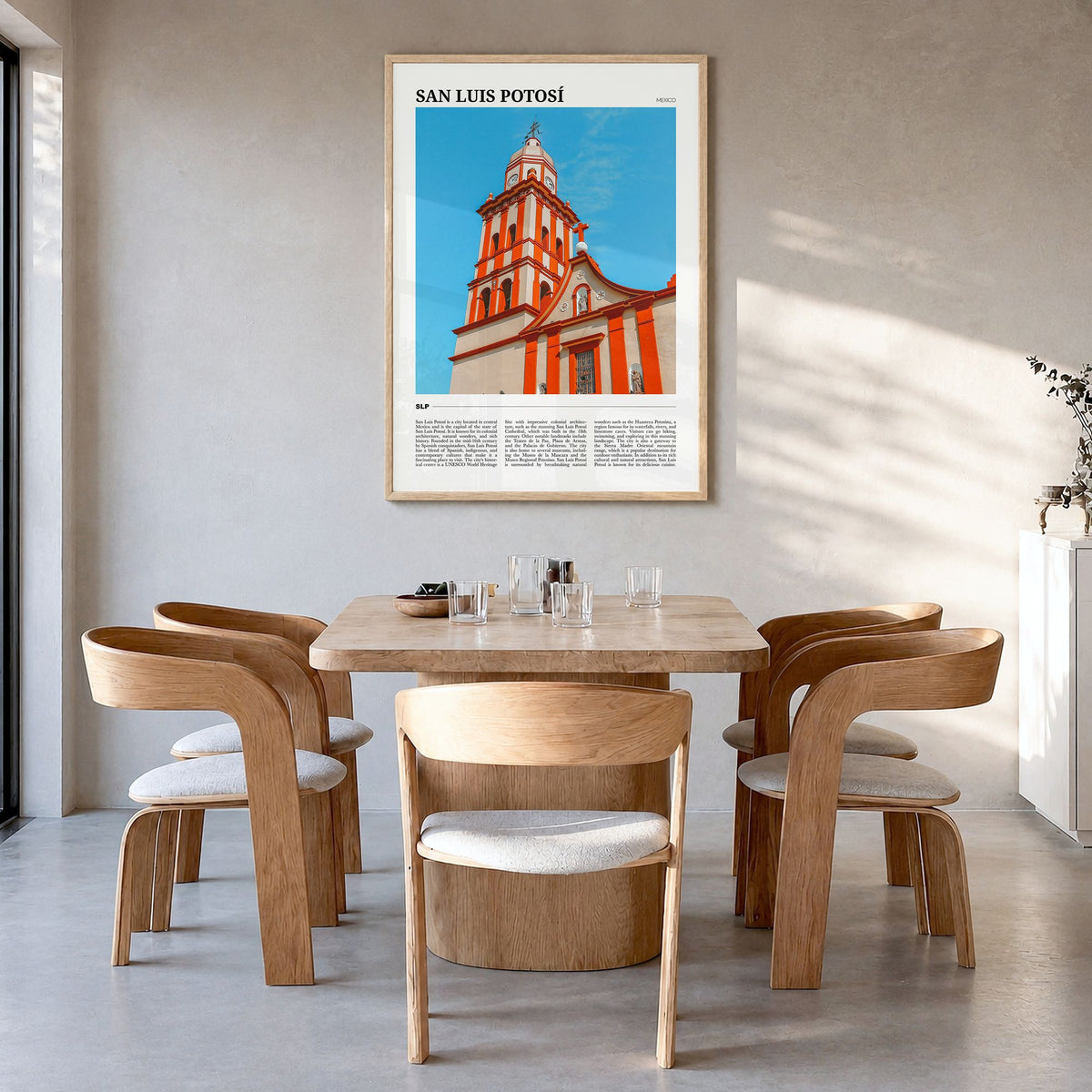 San Luis Potosí Travel Poster in a natural wood frame, hanging in a dining room
