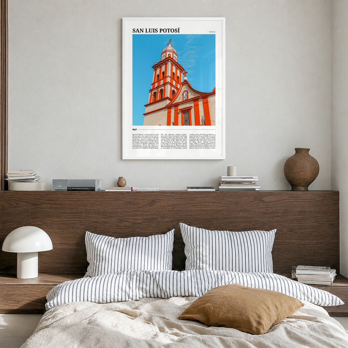 San Luis Potosí Travel Poster in a white wood frame, hanging in a bedroom