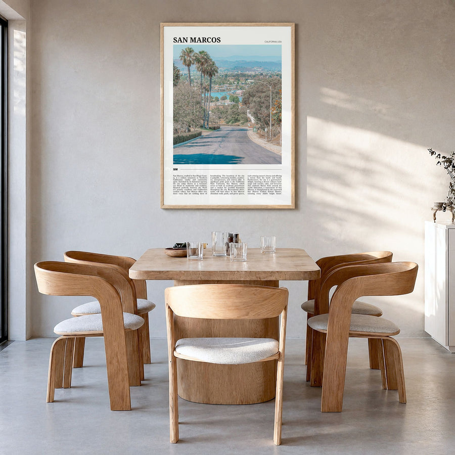 San Marcos Travel Poster in a natural wood frame, hanging in a dining room