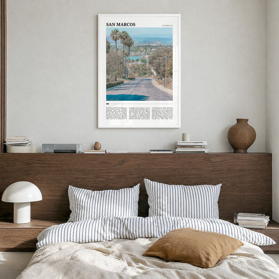 San Marcos Travel Poster in a white wood frame, hanging in a bedroom