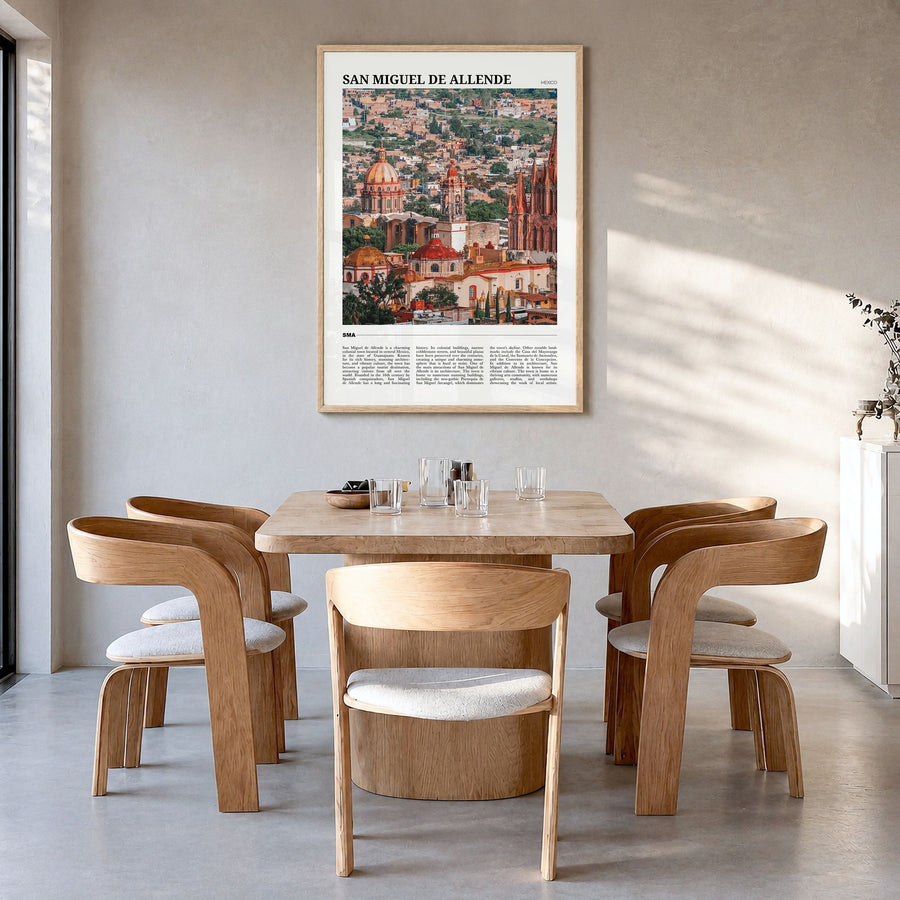 San Miguel de Allende Travel Poster in a natural wood frame, hanging in a dining room