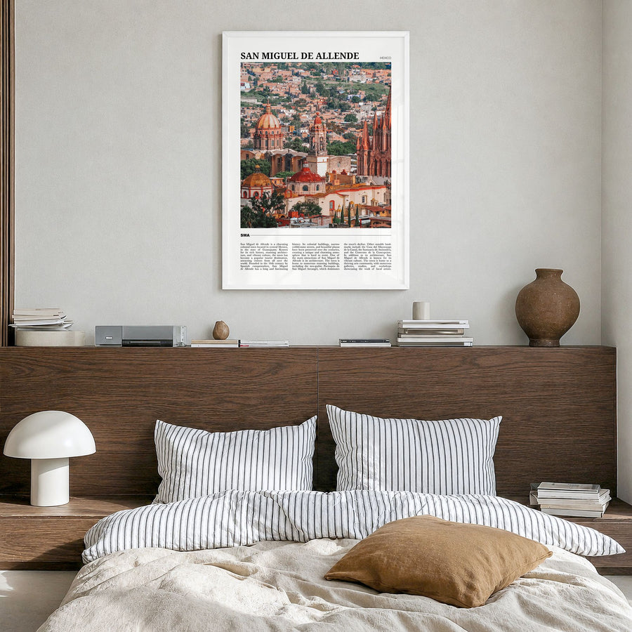San Miguel de Allende Travel Poster in a white wood frame, hanging in a bedroom