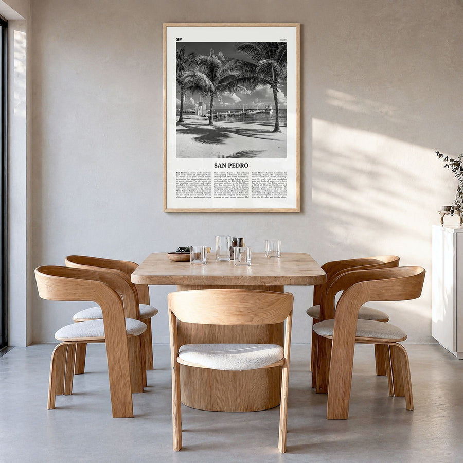 San Pedro, Belize Newspaper Poster in a natural wood frame, hanging in a dining room