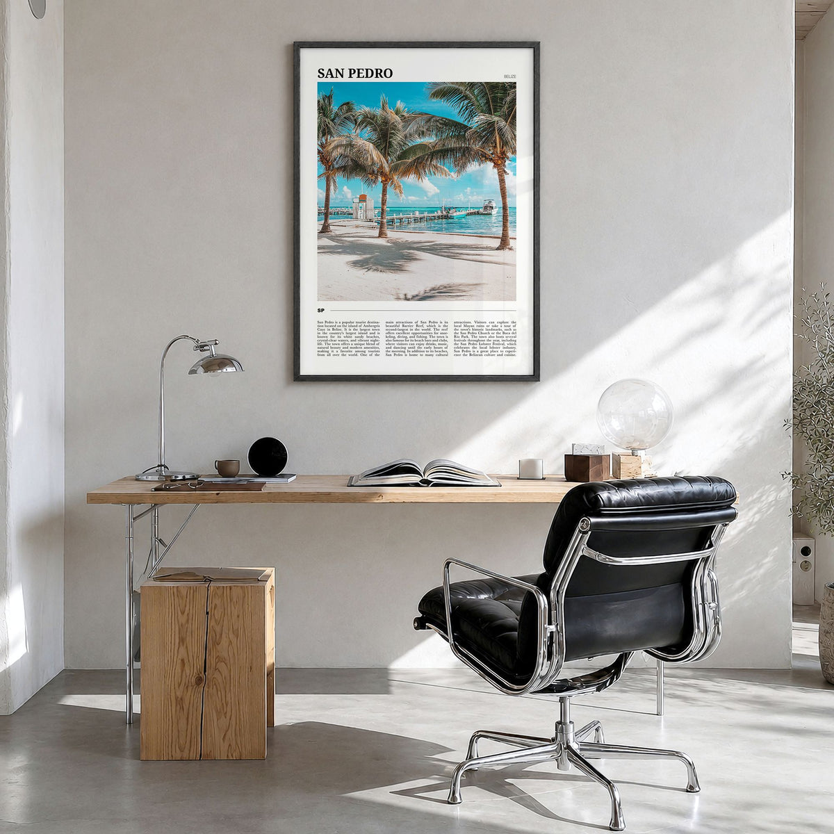 San Pedro, Belize Travel Poster in a black wood frame, hanging in a bright home office