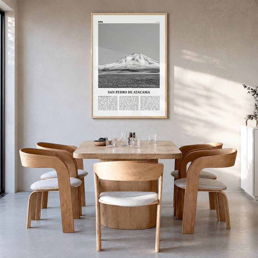 San Pedro de Atacama Newspaper Poster in a natural wood frame, hanging in a dining room