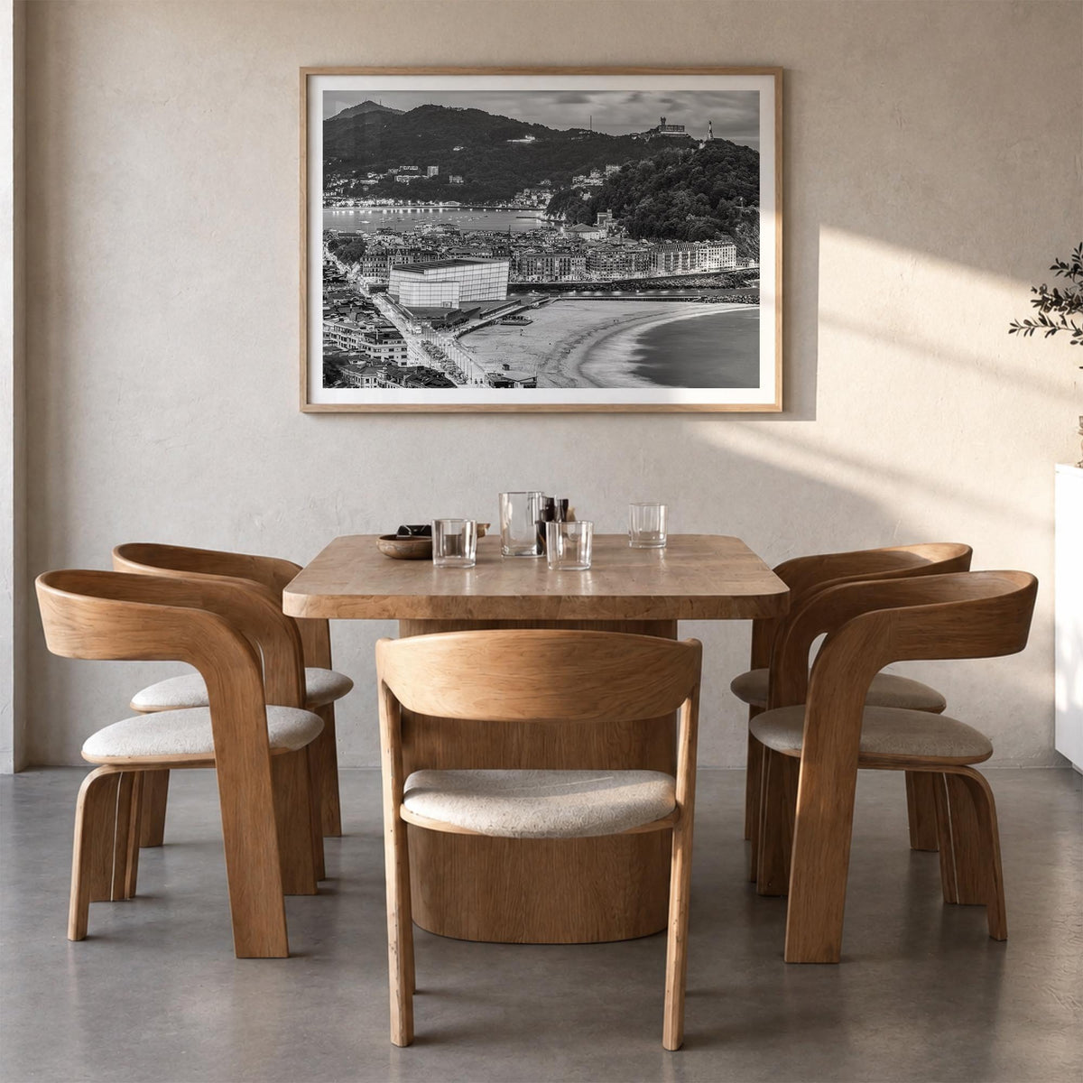 San Sebastián black & white photo poster of Spain – horizontal wall art in natural wood frame with white border, hanging on w
