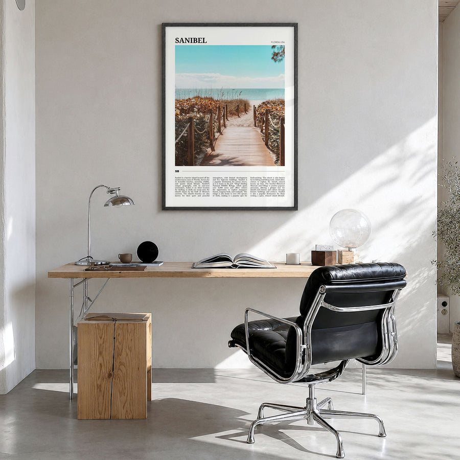 Sanibel Travel Poster in a black wood frame, hanging in a bright home office