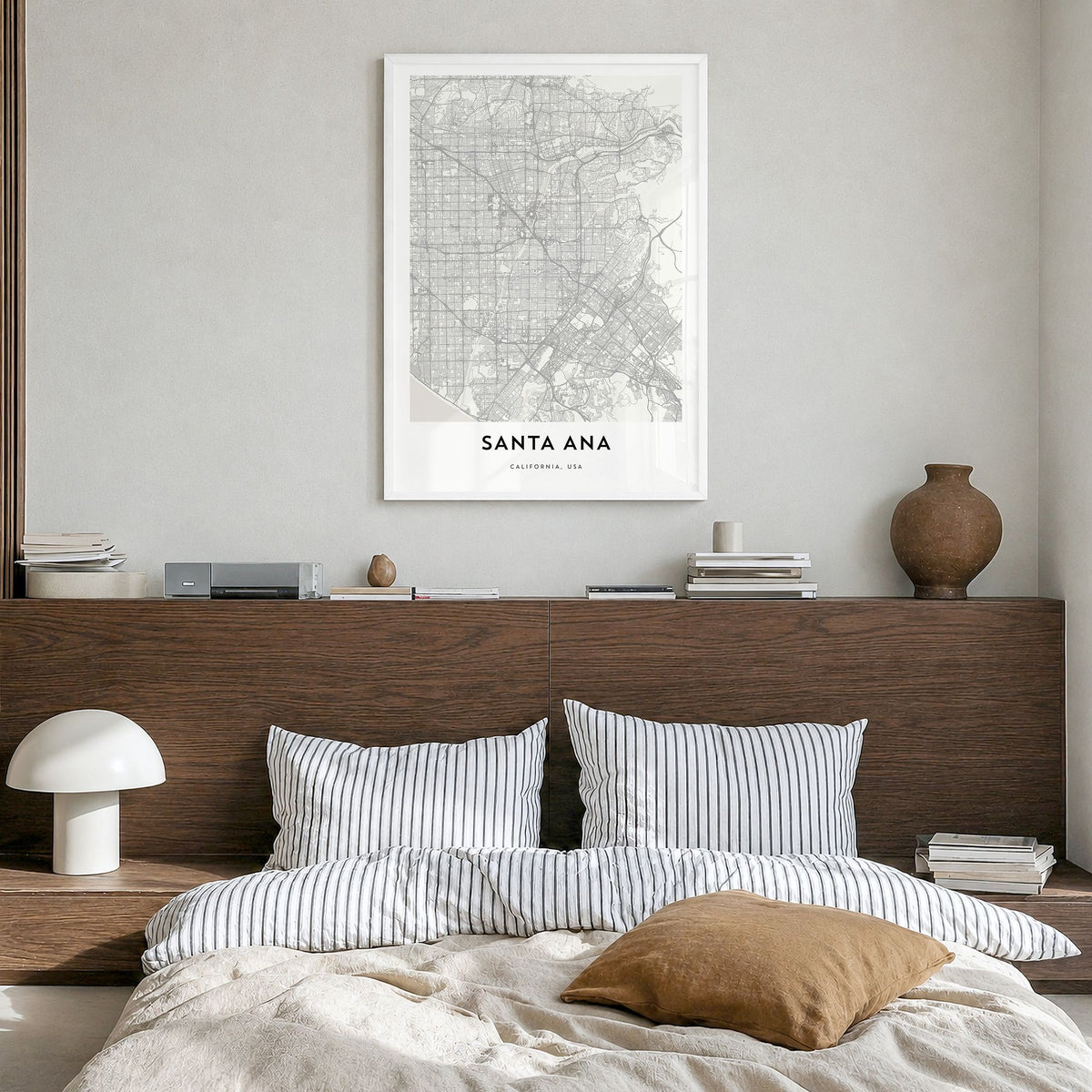 Santa Ana Map Poster in a white wood frame, hanging in a bedroom