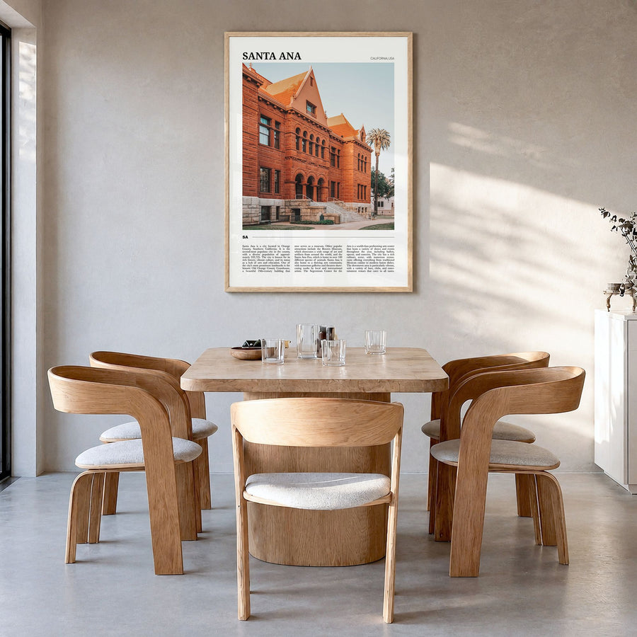 Santa Ana Travel Poster in a natural wood frame, hanging in a dining room