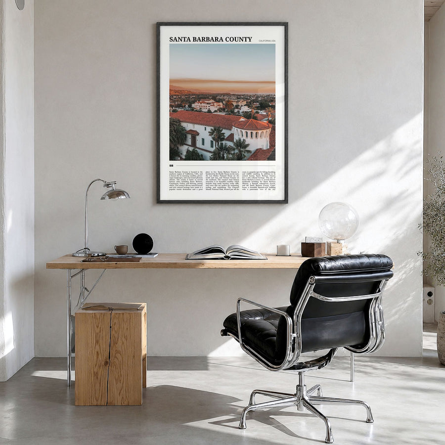 Santa Barbara County Travel Poster in a black wood frame, hanging in a bright home office