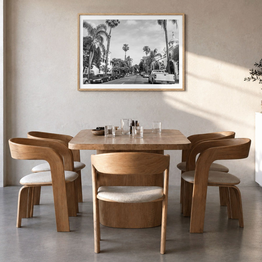 Santa Barbara Photo Poster in a natural wood frame, hanging in a dining room, white border