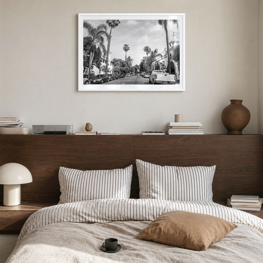 Santa Barbara Photo Poster in a white wood frame, hanging in a bedroom, white border