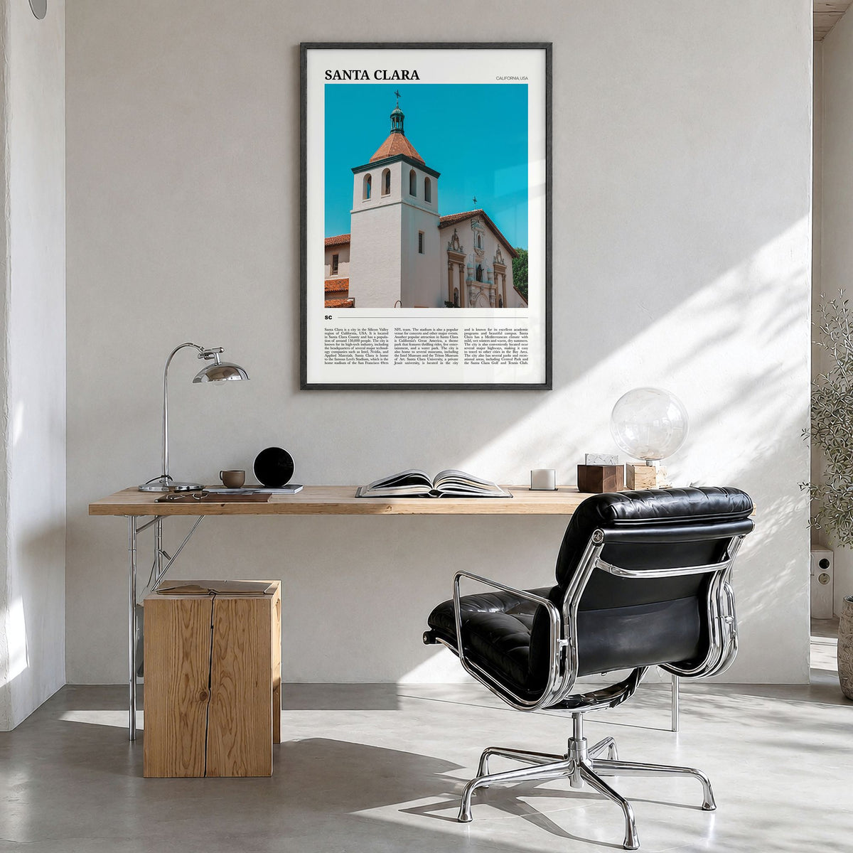 Santa Clara Travel Poster in a black wood frame, hanging in a bright home office