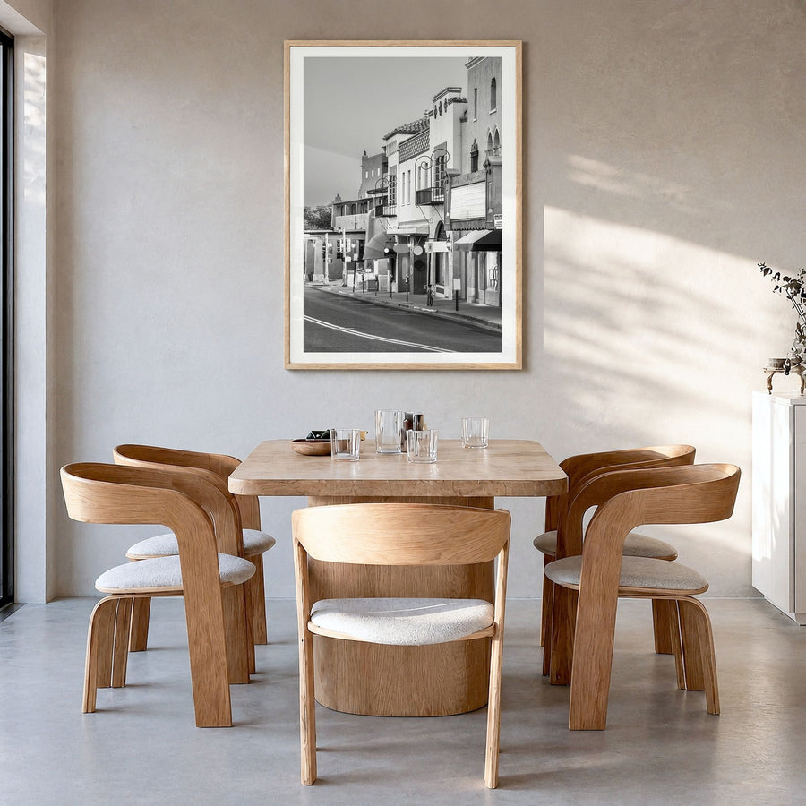 Santa Fe Photo Poster in a natural wood frame, hanging in a dining room, white border