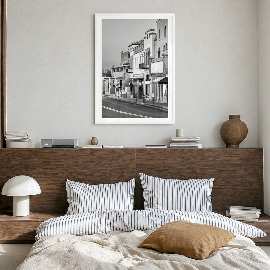 Santa Fe Photo Poster in a white wood frame, hanging in a bedroom, white border