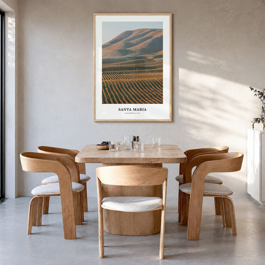 Santa Maria Classic Poster in a natural wood frame, hanging in a dining room