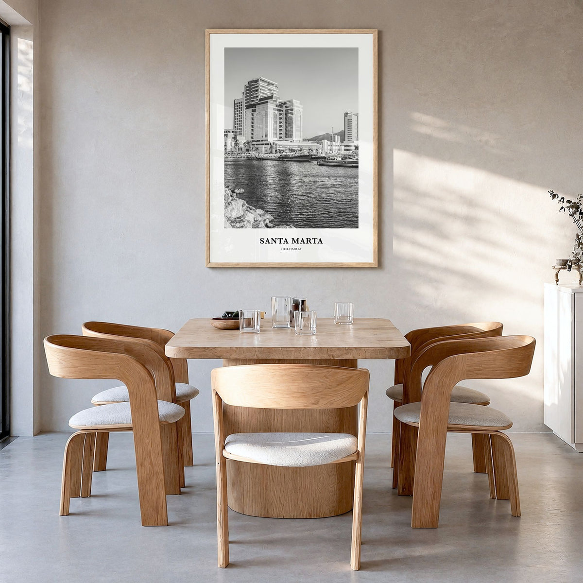 Santa Marta Classic Poster in a natural wood frame, hanging in a dining room