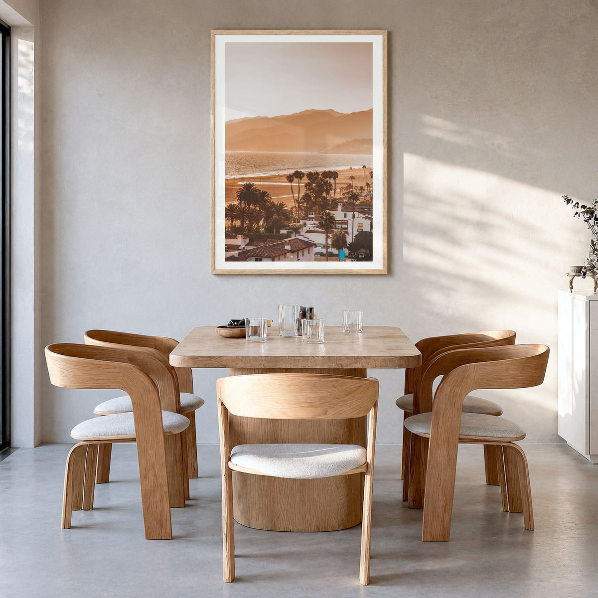 Santa Monica Photo No 1 Poster in a natural wood frame, hanging in a dining room, white border
