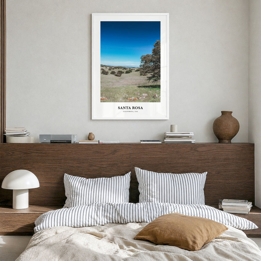 Santa Rosa Classic No 2 Poster in a white wood frame, hanging in a bedroom