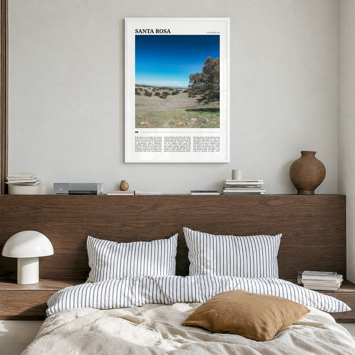 Santa Rosa Travel No 2 Poster in a white wood frame, hanging in a bedroom