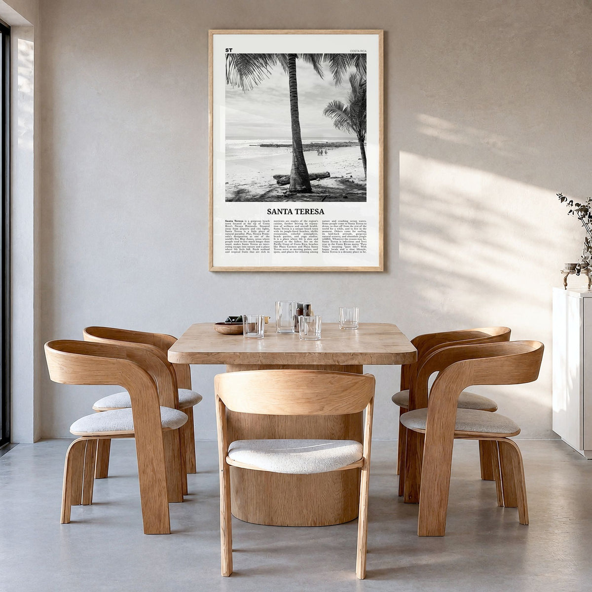 Santa Teresa Newspaper Poster in a natural wood frame, hanging in a dining room