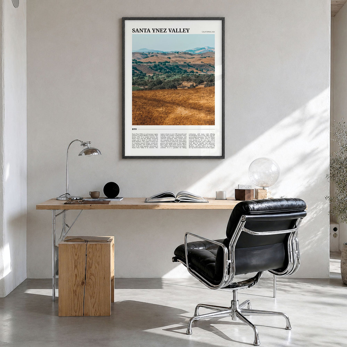 Santa Ynez Valley Travel Poster in a black wood frame, hanging in a bright home office