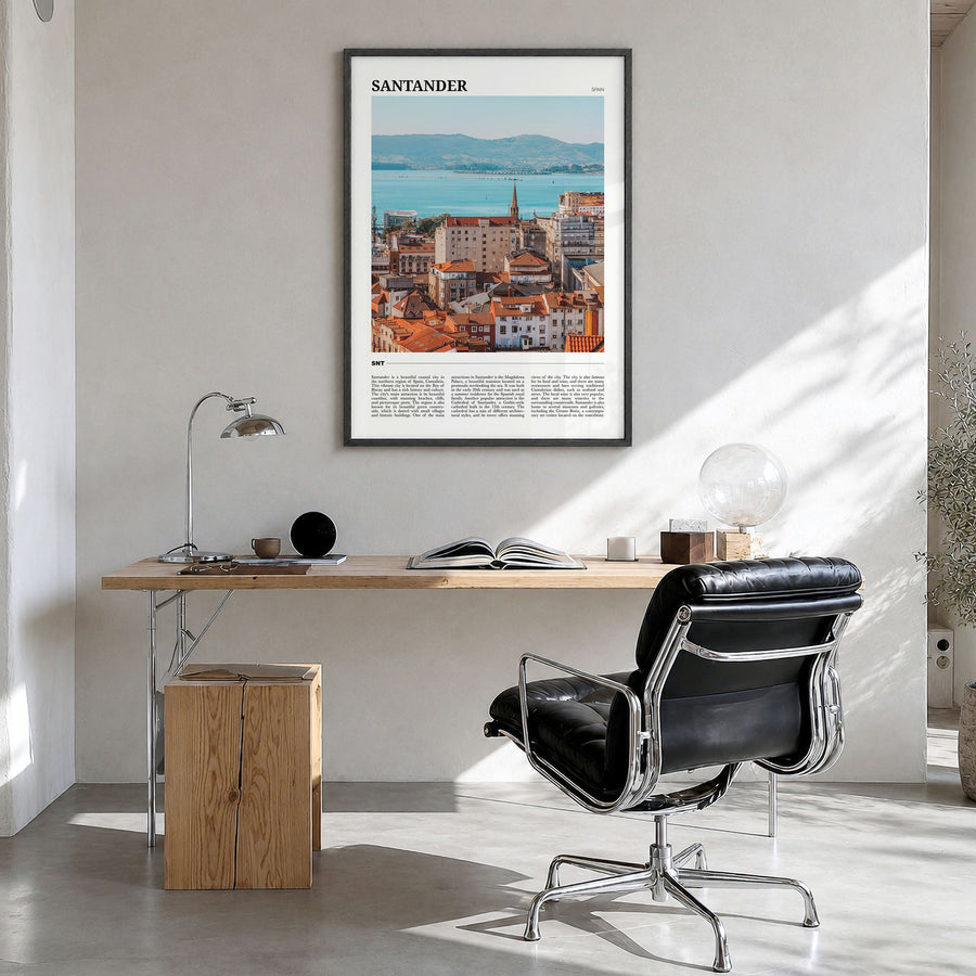 Santander Travel Poster in a black wood frame, hanging in a bright home office
