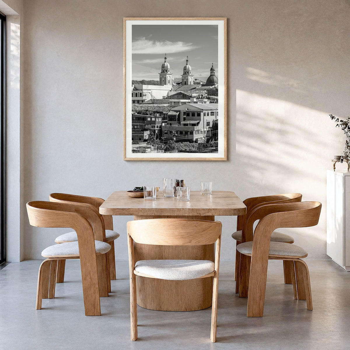 Santiago de Cuba Photo Poster in a natural wood frame, hanging in a dining room, white border