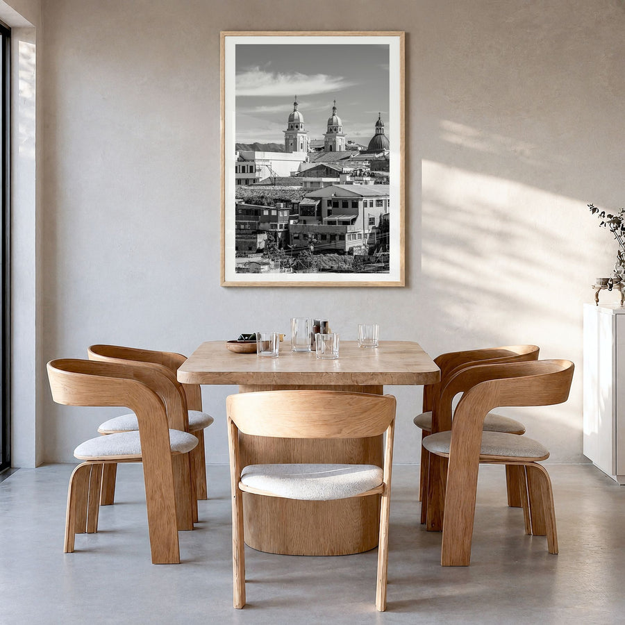Santiago de Cuba Photo Poster in a natural wood frame, hanging in a dining room, white border