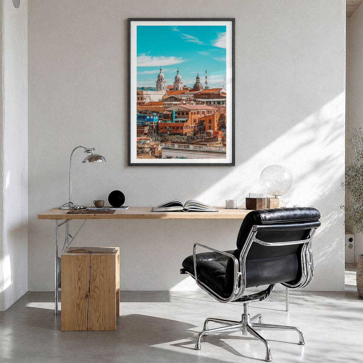 Santiago de Cuba Photo Poster in a black wood frame, hanging in a bright home office, white border