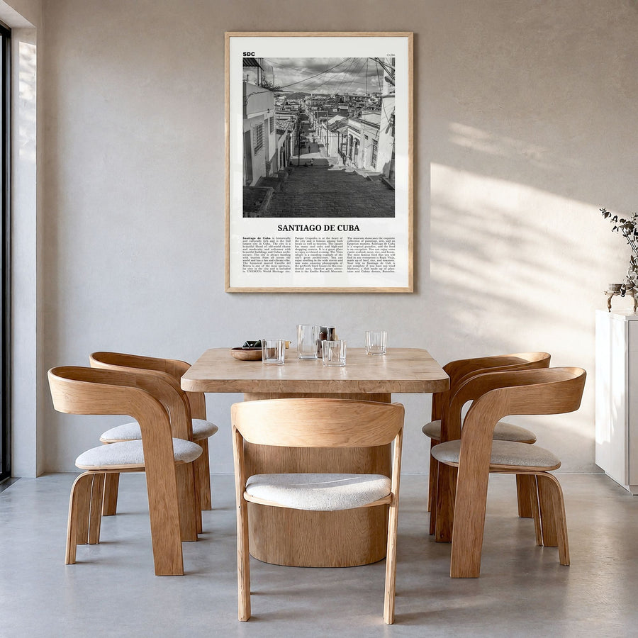 Santiago de Cuba Newspaper Poster in a natural wood frame, hanging in a dining room