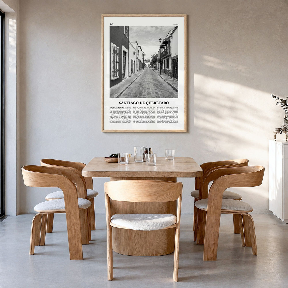 Santiago de Querétaro Newspaper Poster in a natural wood frame, hanging in a dining room