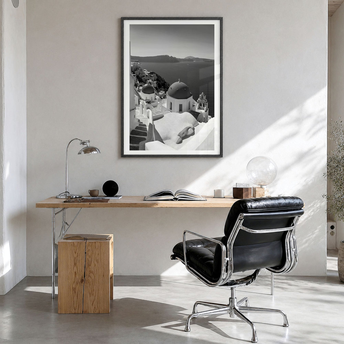 Santorini Photo No 2 Poster in a black wood frame, hanging in a bright home office, white border