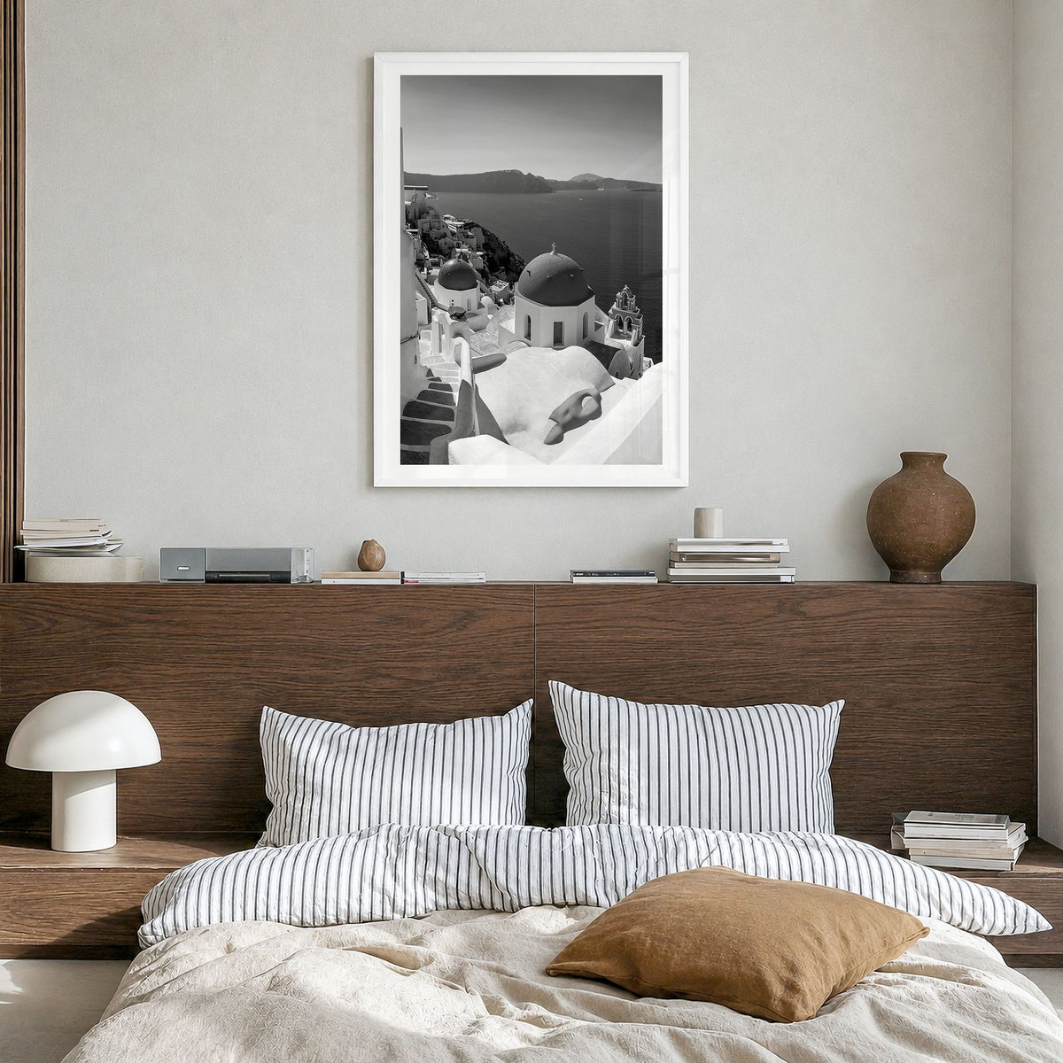 Santorini Photo No 2 Poster in a white wood frame, hanging in a bedroom, white border