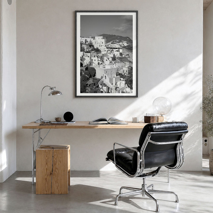 Santorini Photo No 4 Poster in a black wood frame, hanging in a bright home office, white border