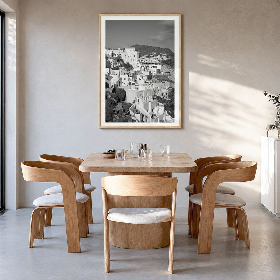 Santorini Photo No 4 Poster in a natural wood frame, hanging in a dining room, white border