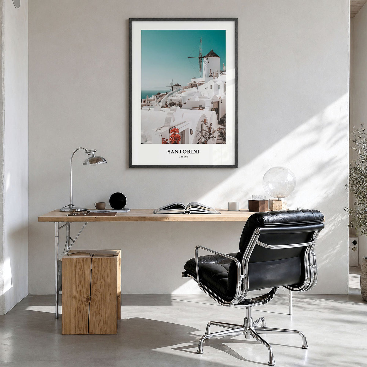 Santorini Classic Poster in a black wood frame, hanging in a bright home office