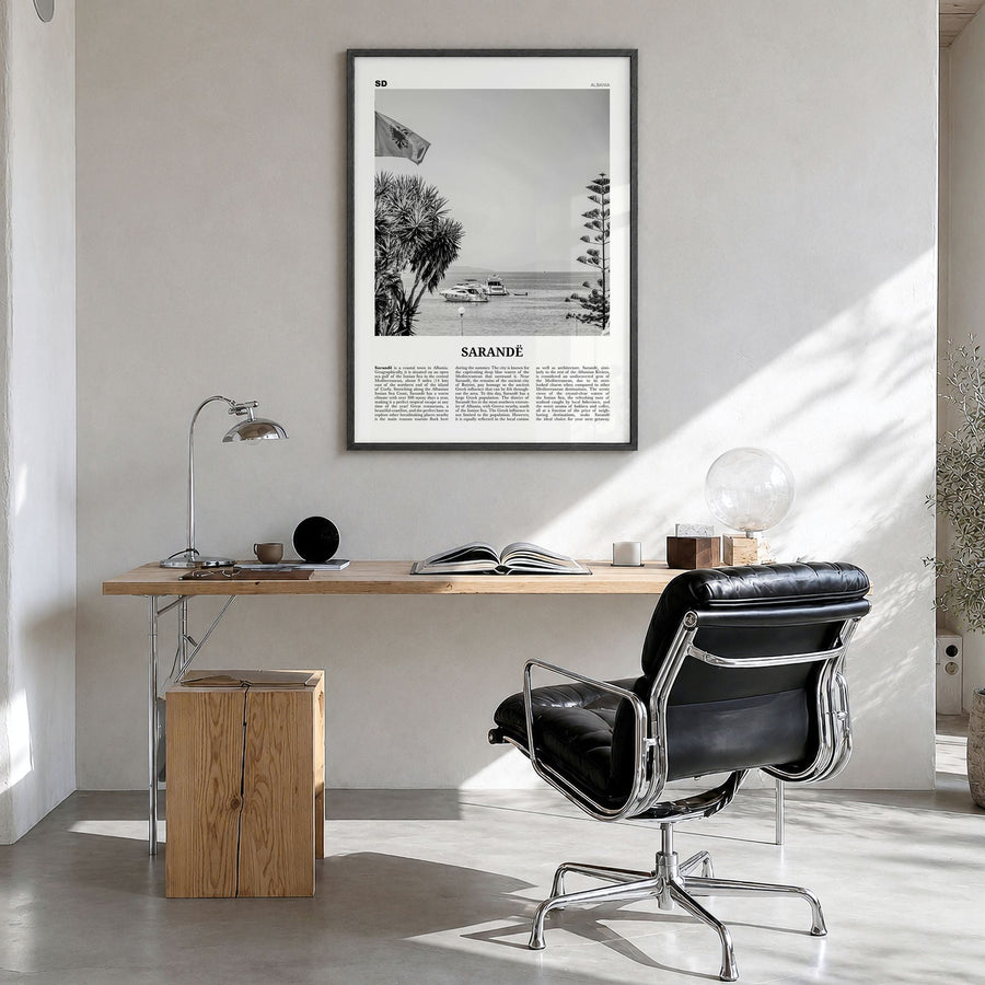 Sarandë Newspaper Poster in a black wood frame, hanging in a bright home office