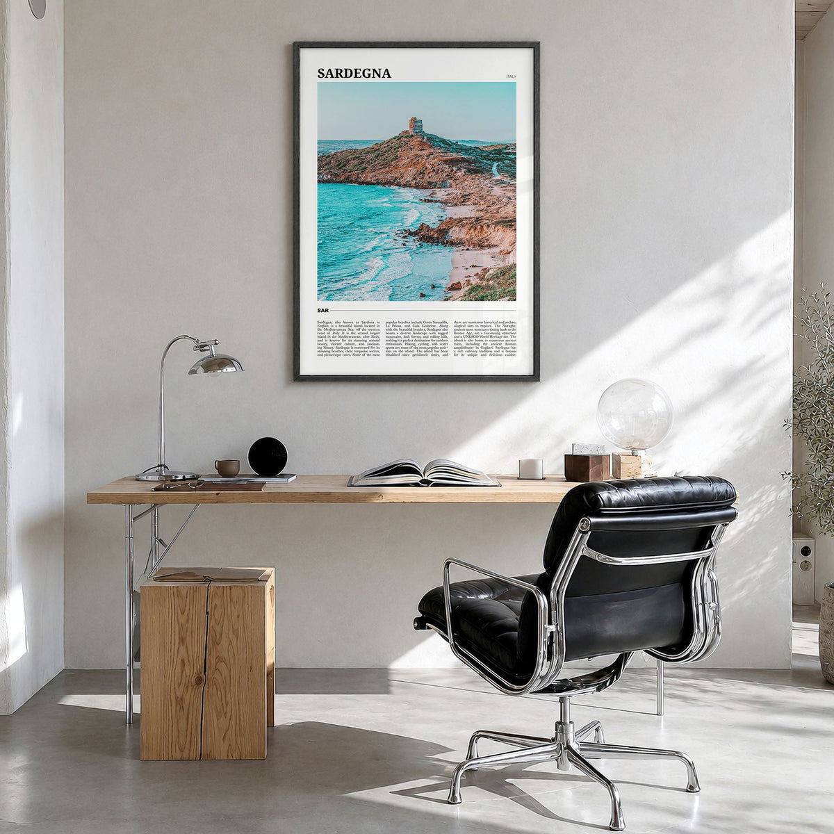 Sardegna Travel Poster in a black wood frame, hanging in a bright home office
