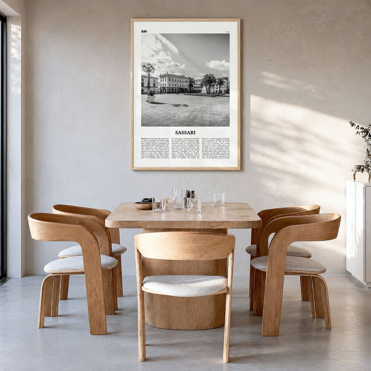 Sassari Newspaper Poster in a natural wood frame, hanging in a dining room
