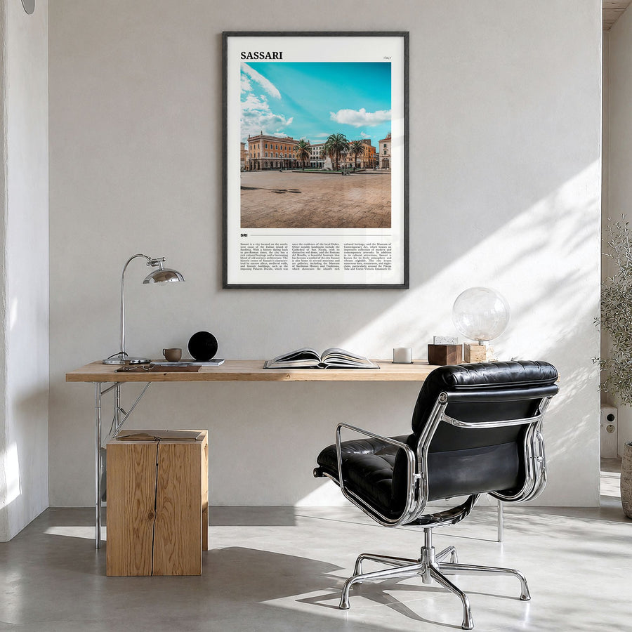 Sassari Travel Poster in a black wood frame, hanging in a bright home office