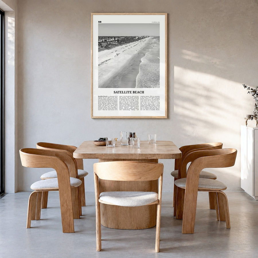 Satellite Beach Newspaper Poster in a natural wood frame, hanging in a dining room