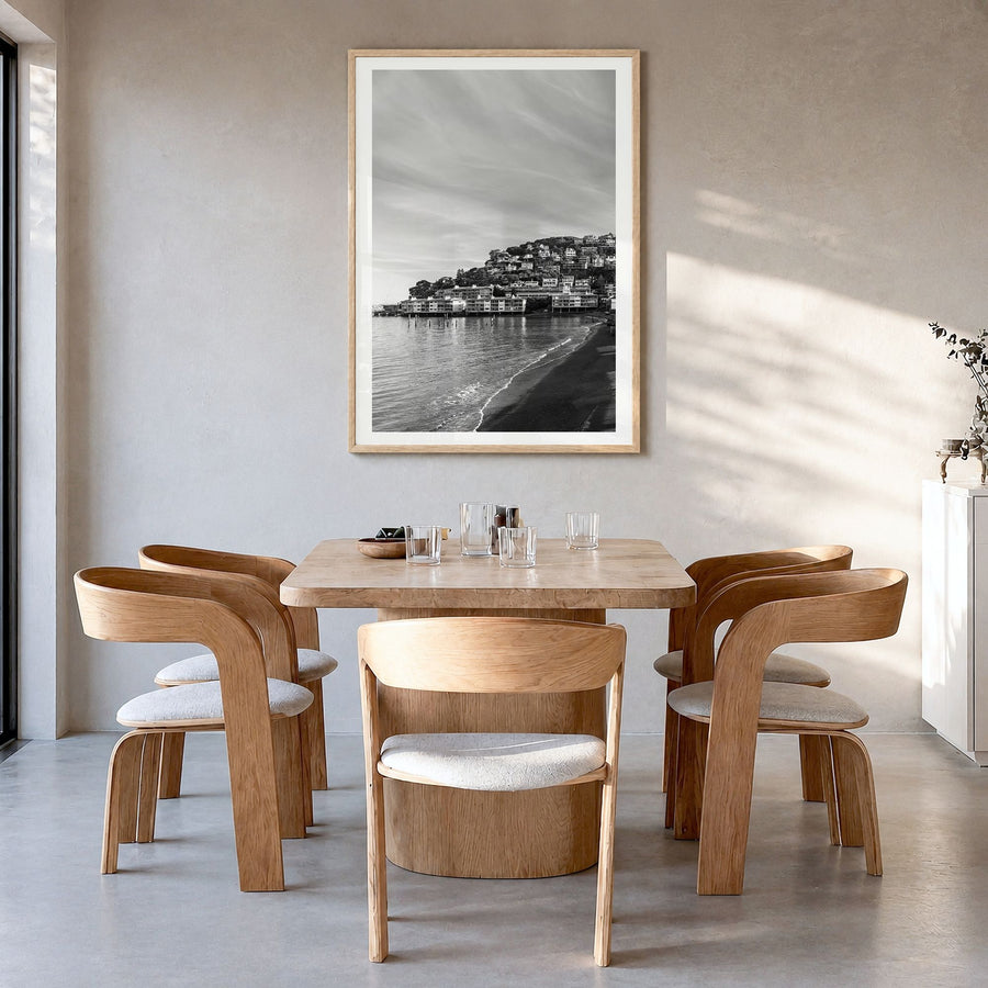 Sausalito Photo Poster in a natural wood frame, hanging in a dining room, white border