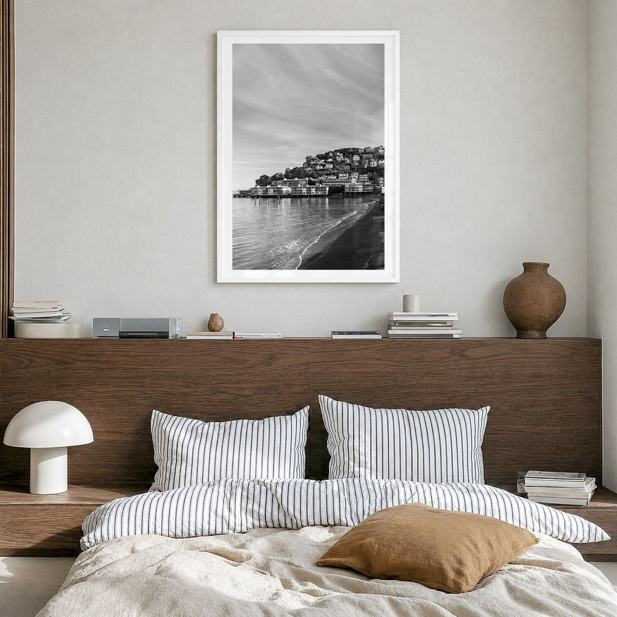 Sausalito Photo Poster in a white wood frame, hanging in a bedroom, white border