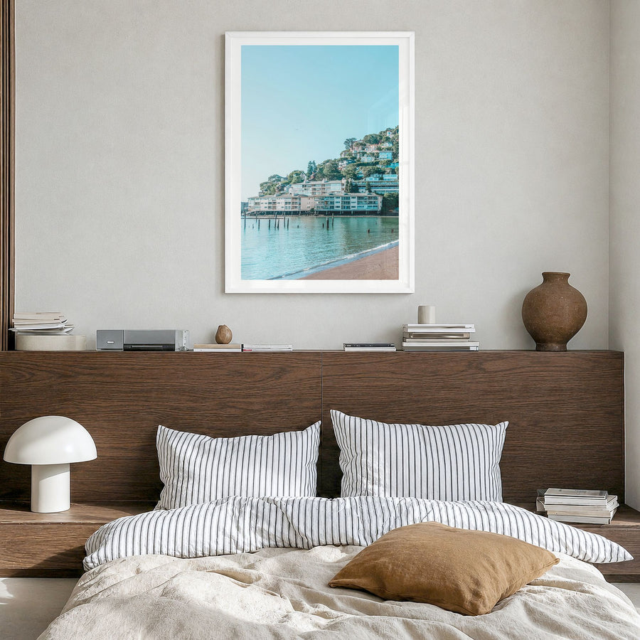 Sausalito Photo Poster in a white wood frame, hanging in a bedroom, white border