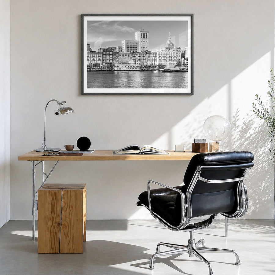 Savannah Photo Poster in a black wood frame, hanging in a bright home office, white border