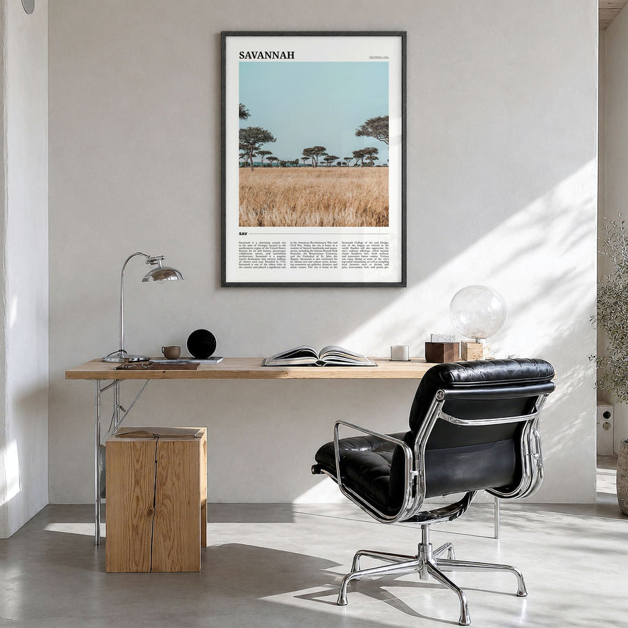 Savannah Travel Poster in a black wood frame, hanging in a bright home office