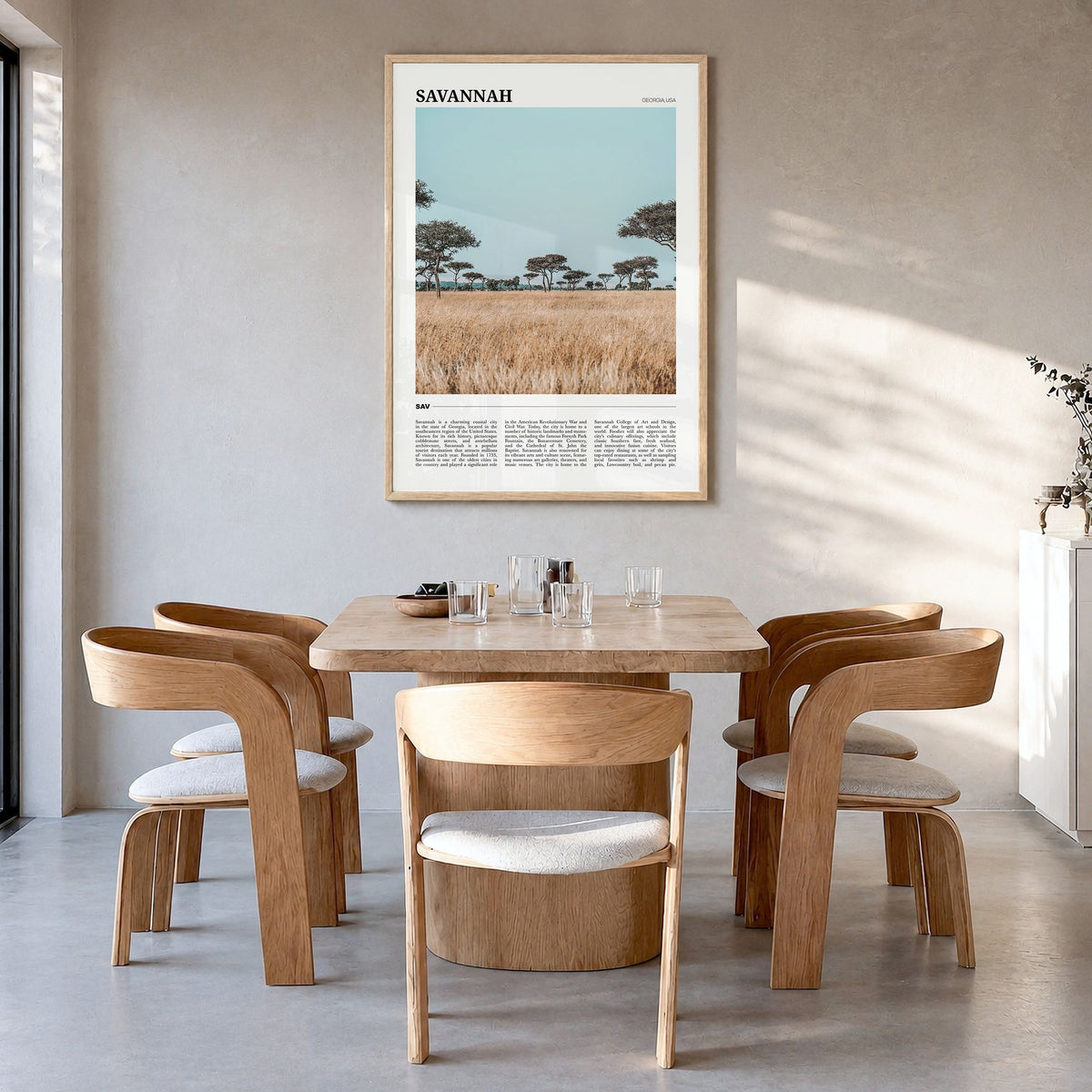 Savannah Travel Poster in a natural wood frame, hanging in a dining room