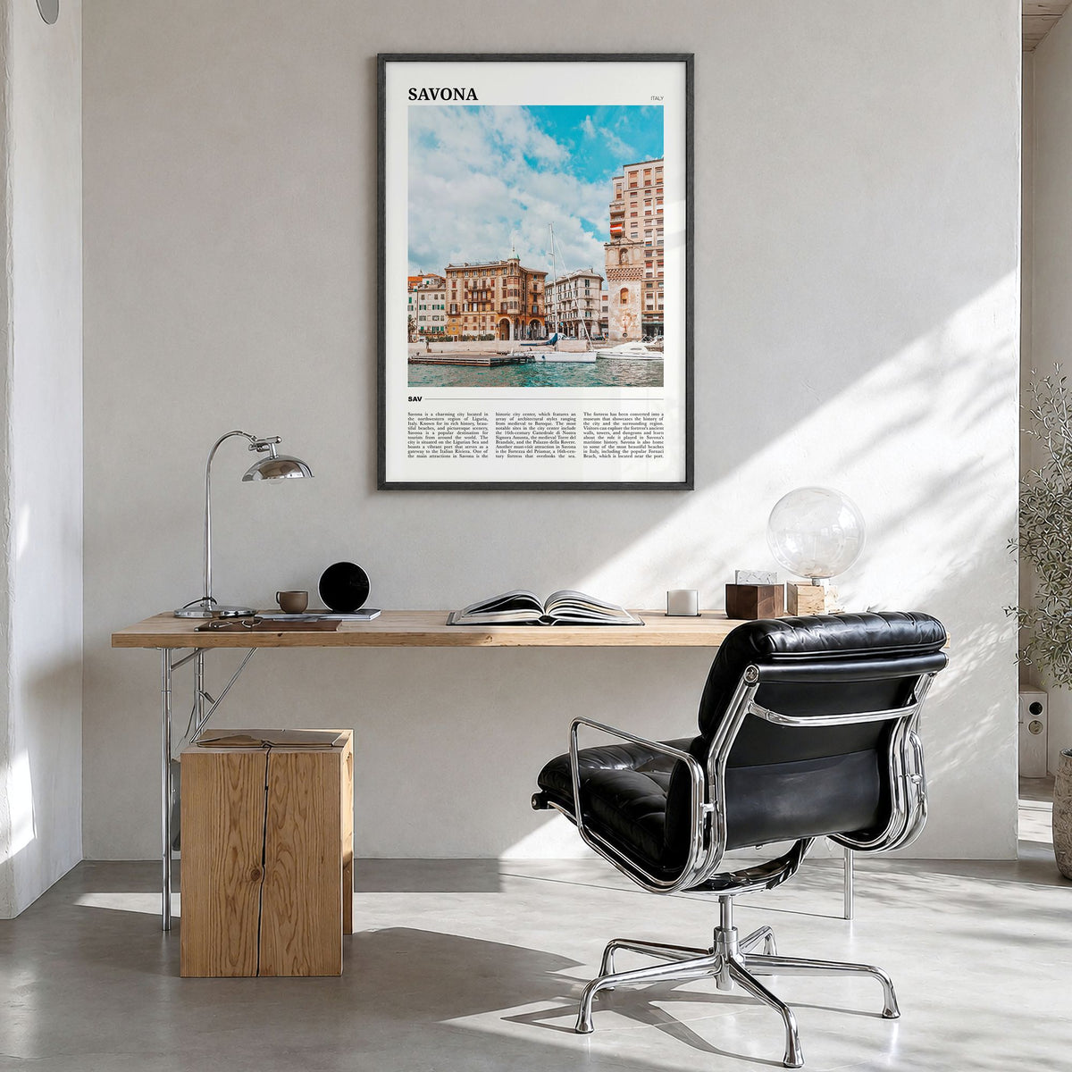 Savona Travel Poster in a black wood frame, hanging in a bright home office